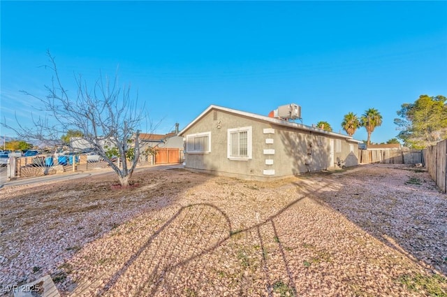 back of property featuring cooling unit