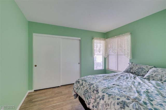 bedroom featuring a closet and light hardwood / wood-style floors