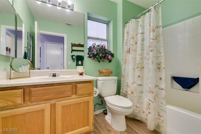 full bathroom featuring toilet, vanity, shower / bath combination with curtain, and hardwood / wood-style flooring