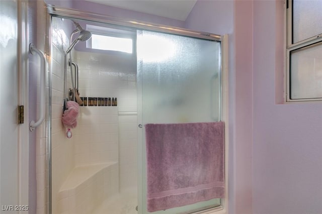 bathroom featuring an enclosed shower