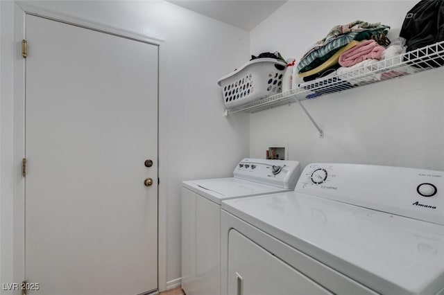 clothes washing area featuring independent washer and dryer