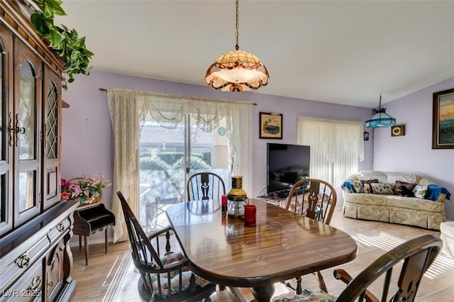 dining area with light hardwood / wood-style floors