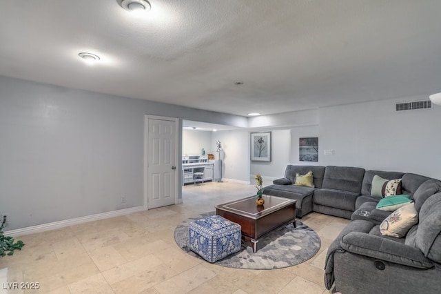 living room featuring a textured ceiling