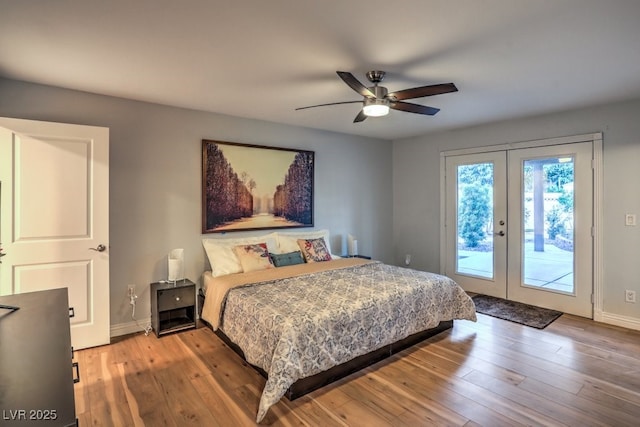 bedroom with ceiling fan, access to exterior, french doors, and wood-type flooring