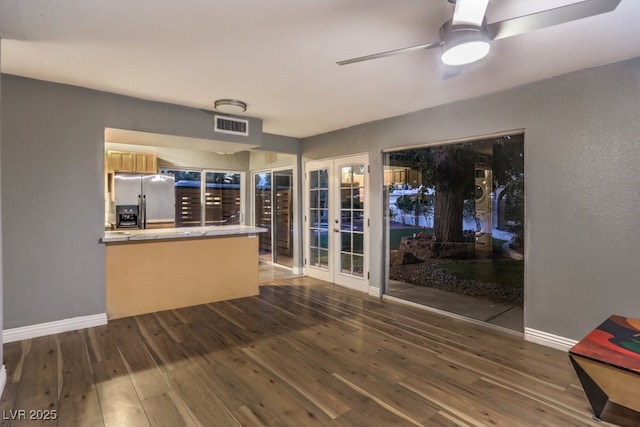 interior space featuring ceiling fan, dark hardwood / wood-style flooring, and french doors