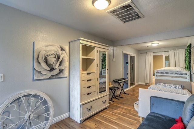 bedroom with light hardwood / wood-style flooring