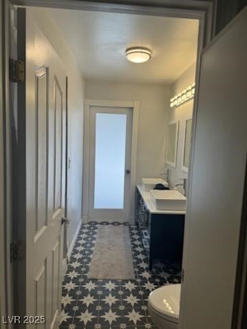 bathroom with toilet and vanity