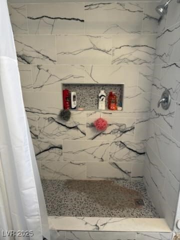 bathroom with a shower with shower curtain