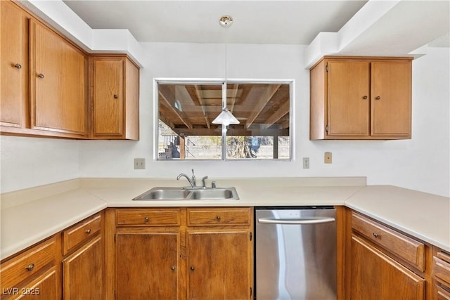 kitchen featuring sink, hanging light fixtures, and stainless steel dishwasher