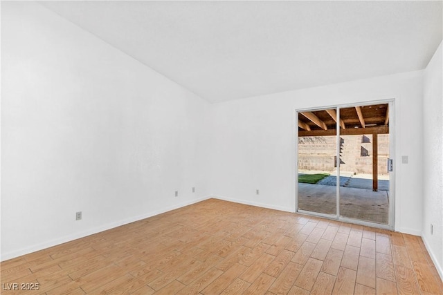 spare room featuring light hardwood / wood-style flooring