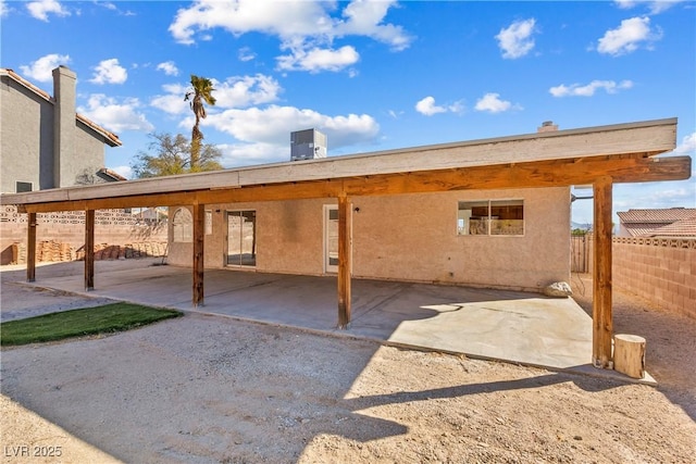 back of property with a patio area and cooling unit