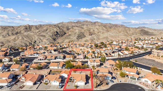 birds eye view of property with a mountain view