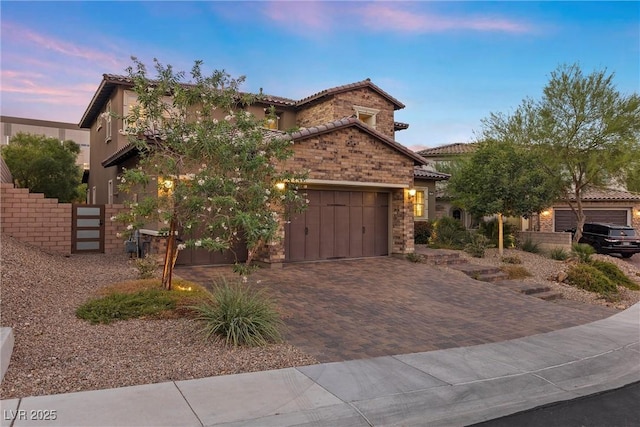 mediterranean / spanish home featuring a garage