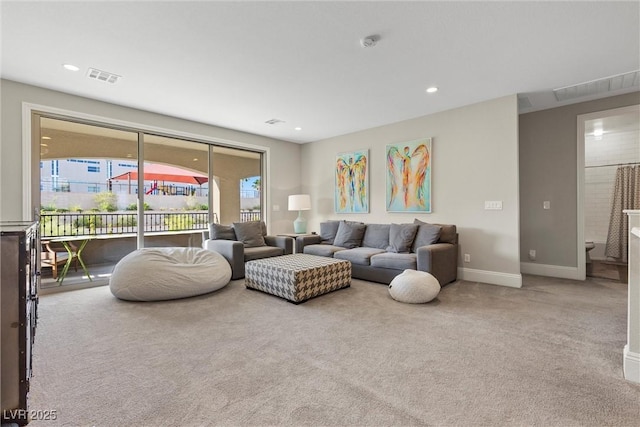 living room with light colored carpet