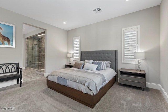 bedroom featuring carpet and connected bathroom