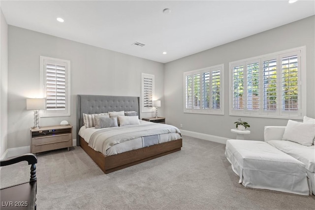 bedroom featuring light carpet