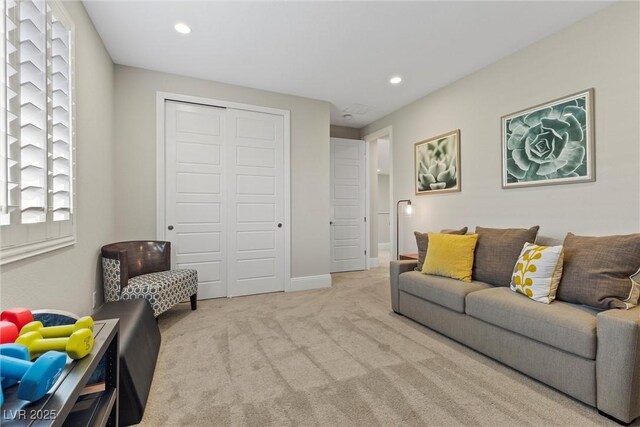 carpeted living room with a healthy amount of sunlight