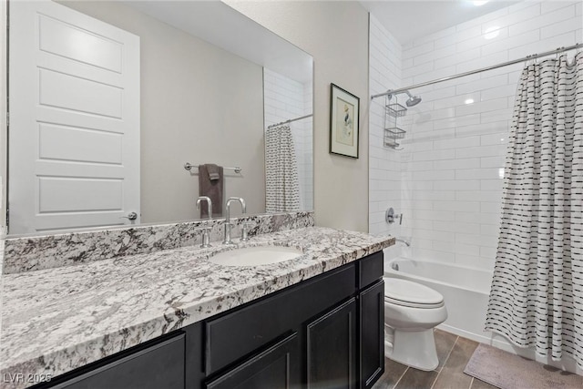 full bathroom featuring shower / bath combination with curtain, vanity, and toilet