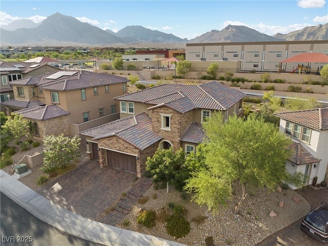 birds eye view of property featuring a mountain view