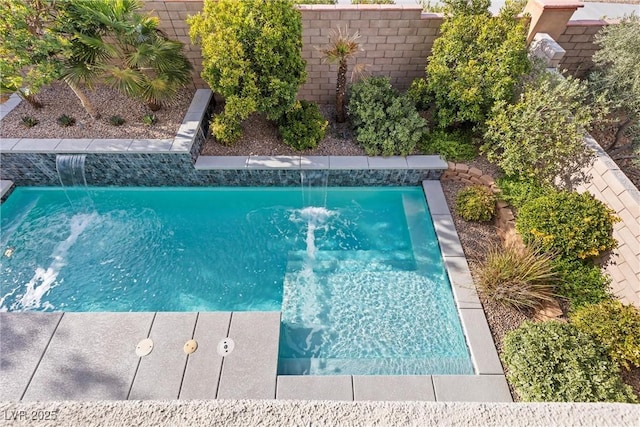 view of swimming pool featuring pool water feature