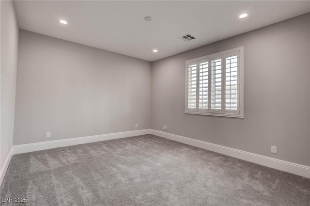 spare room with recessed lighting, carpet floors, and baseboards