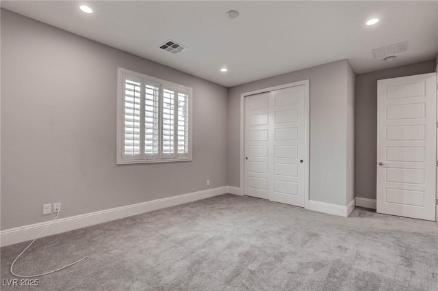 unfurnished bedroom featuring recessed lighting, carpet, and baseboards
