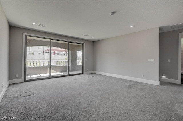 carpeted spare room with recessed lighting, visible vents, and baseboards