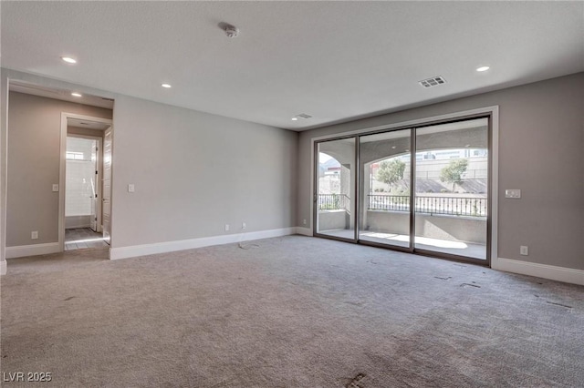 unfurnished room with recessed lighting, light carpet, and baseboards
