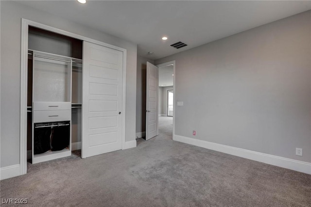 unfurnished bedroom featuring baseboards, carpet floors, visible vents, and recessed lighting