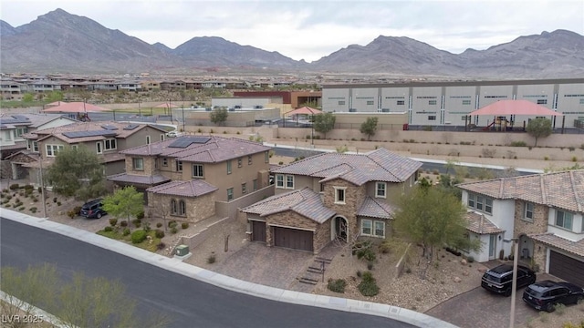 birds eye view of property with a mountain view and a residential view