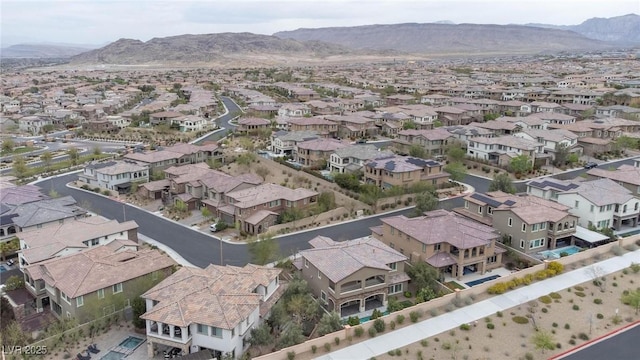 birds eye view of property featuring a mountain view and a residential view