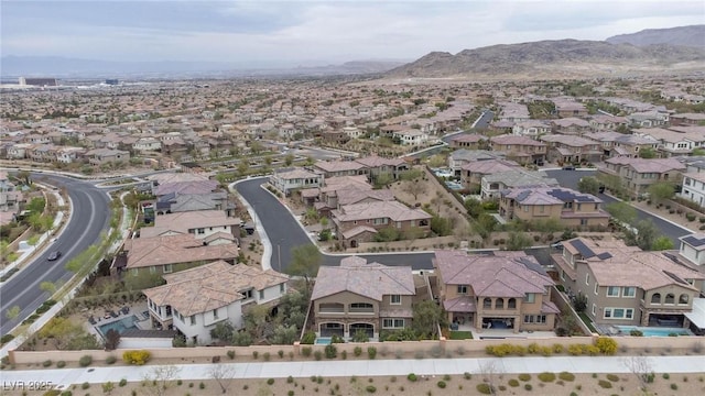 drone / aerial view with a residential view and a mountain view