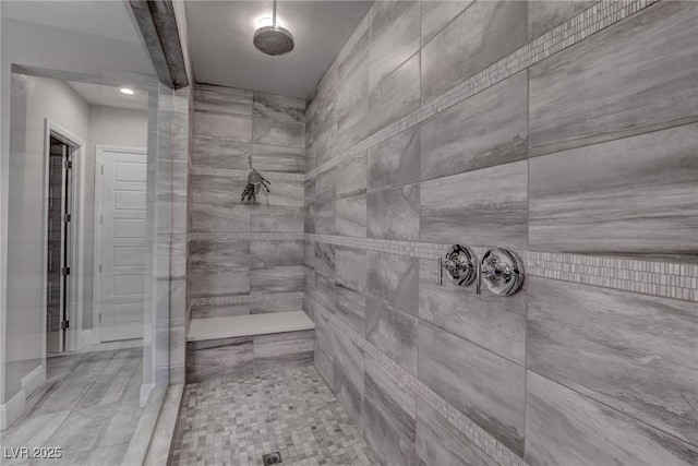 full bath with tiled shower