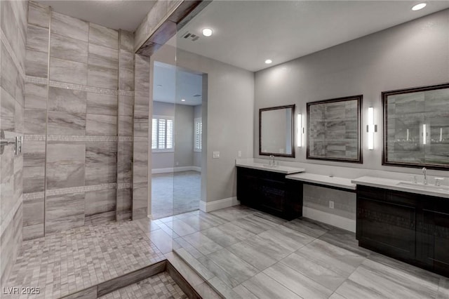 bathroom featuring two vanities, a sink, visible vents, and recessed lighting