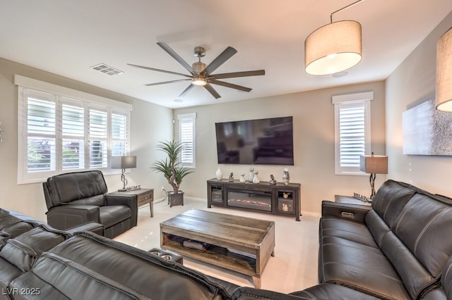 living room with ceiling fan and light colored carpet