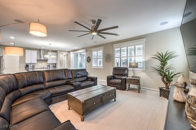 living room with ceiling fan and light carpet