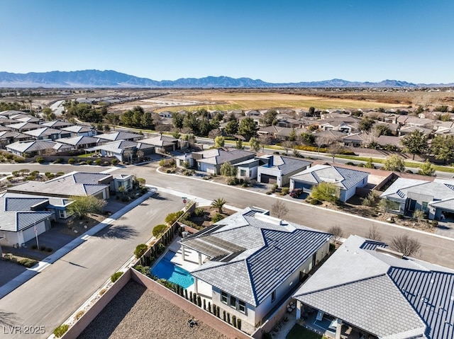 drone / aerial view featuring a mountain view