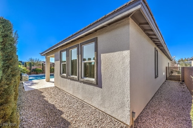 view of side of property featuring a patio