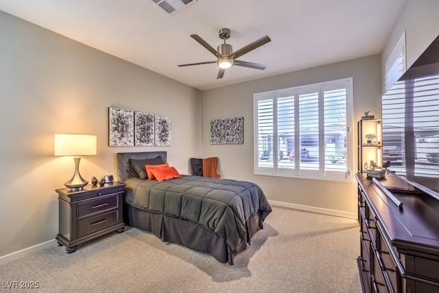 bedroom featuring ceiling fan and light carpet