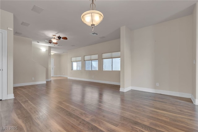 empty room featuring dark hardwood / wood-style floors and ceiling fan