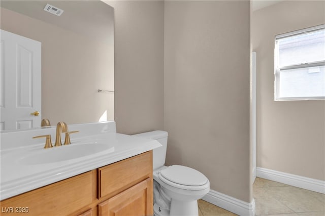 bathroom with tile patterned floors, toilet, and vanity