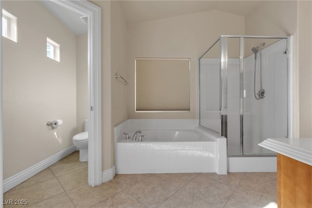 bathroom with tile patterned flooring, shower with separate bathtub, lofted ceiling, and toilet