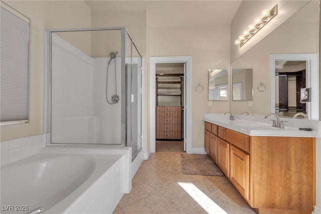 bathroom with vanity, tile patterned floors, and separate shower and tub