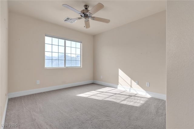 empty room with light carpet and ceiling fan