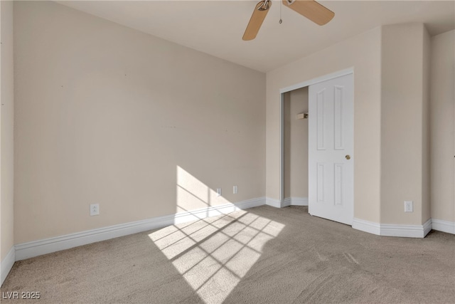 unfurnished bedroom featuring ceiling fan, carpet flooring, and a closet