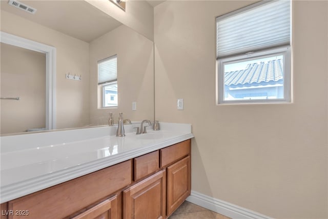 bathroom featuring tile patterned floors and vanity