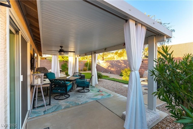 view of patio featuring ceiling fan