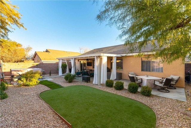 rear view of house with a patio area and outdoor lounge area