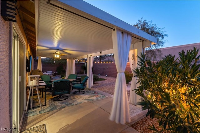 patio terrace at dusk with ceiling fan