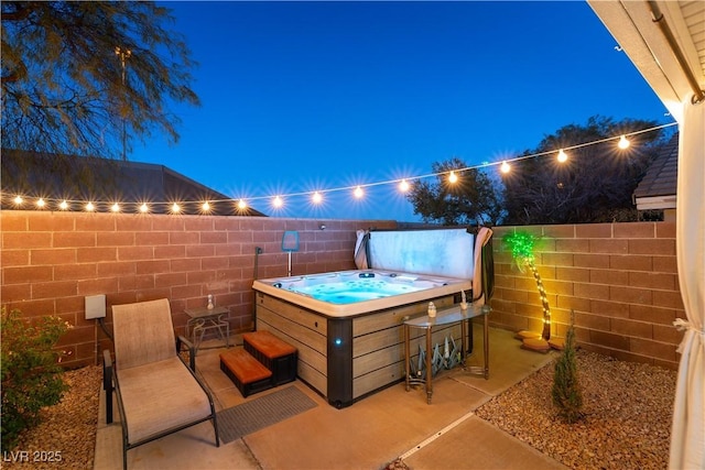 view of patio with a hot tub